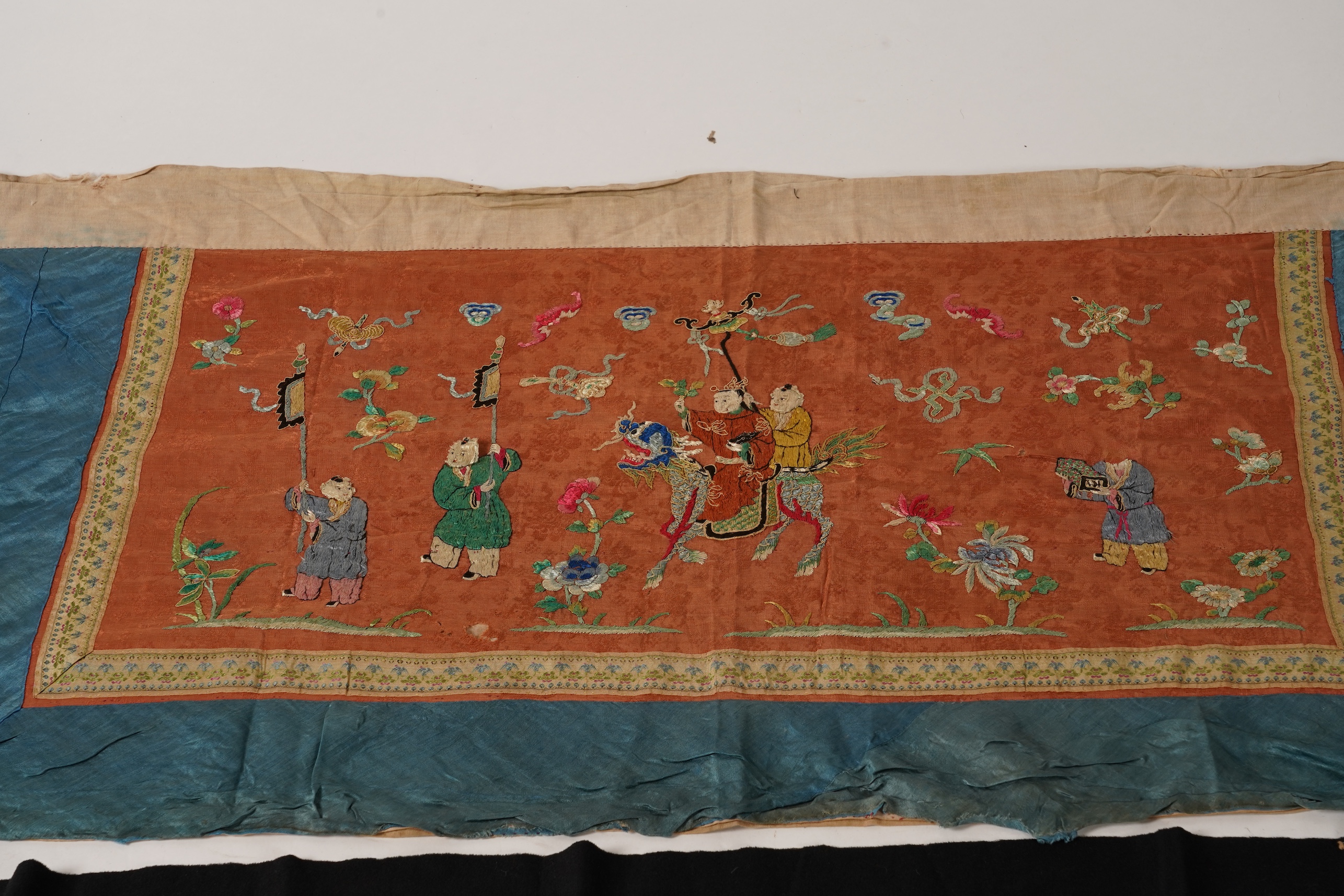 Four Chinese embroidered silk panels, late 19th/early 20th century and a similar Indian panel